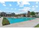 The outdoor pool area features an ample sundeck with lounge chairs for relaxing by the clear, cool water at 732 W Flintlock Way, Chandler, AZ 85286