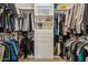 Custom walk-in closet with built in shelving and drawer space for optimal storage at 732 W Flintlock Way, Chandler, AZ 85286