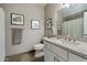 Well-lit bathroom with granite counters, white cabinets, and neutral walls, offers a clean and comfortable space at 750 E Northern Ave # 2143, Phoenix, AZ 85020