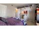 Functional bedroom with dedicated workspace, desk, and shelving, offering a versatile and comfortable living space at 750 E Northern Ave # 2143, Phoenix, AZ 85020