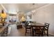 Cozy living and dining room with a balcony and decorative chandelier at 750 E Northern Ave # 2143, Phoenix, AZ 85020