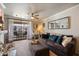 Comfortable living room with a ceiling fan and access to a private balcony at 750 E Northern Ave # 2143, Phoenix, AZ 85020