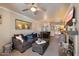 A cozy living room with a neutral color palette, a mirror, and a view of the dining area at 750 E Northern Ave # 2143, Phoenix, AZ 85020