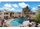 Relaxing swimming pool surrounded by lounge chairs, lush landscaping, and well-maintained buildings at 750 E Northern Ave # 2143, Phoenix, AZ 85020