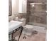 Well-maintained bathroom with tiled shower, modern sink, and stylish fixtures at 7970 E Camelback Rd # 209, Scottsdale, AZ 85251