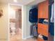 Bathroom features cabinet storage and coordinated fixtures near closet at 7970 E Camelback Rd # 209, Scottsdale, AZ 85251