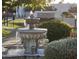 Elegant water fountain with intricate details at the entry of Scottsdale Shadows community at 7970 E Camelback Rd # 209, Scottsdale, AZ 85251