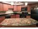 Modern kitchen boasts stainless steel appliances, stone countertops, and ample cabinet space at 7970 E Camelback Rd # 209, Scottsdale, AZ 85251