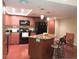 Bright kitchen featuring granite countertops, stainless appliances, and functional island with seating at 7970 E Camelback Rd # 209, Scottsdale, AZ 85251