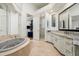 Bathroom featuring soaking tub, granite counters, and a separate shower at 8229 N Ridgeview Dr, Paradise Valley, AZ 85253