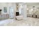 Bright, spacious bathroom with a standalone tub, fireplace, and marble floors at 8229 N Ridgeview Dr, Paradise Valley, AZ 85253