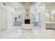Bright, spacious bathroom with a standalone tub, fireplace, and dual vanities at 8229 N Ridgeview Dr, Paradise Valley, AZ 85253