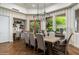 Bright dining room with wood floors, large windows, and a modern light fixture at 8229 N Ridgeview Dr, Paradise Valley, AZ 85253