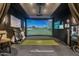 Entertainment space with a golf simulator, projector screen, and golf equipment at 8229 N Ridgeview Dr, Paradise Valley, AZ 85253
