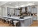 Spacious kitchen with a large island, grey cabinets and a brick backsplash at 8229 N Ridgeview Dr, Paradise Valley, AZ 85253