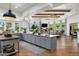 Open kitchen with an island that flows into the living and dining areas at 8229 N Ridgeview Dr, Paradise Valley, AZ 85253