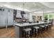 Gourmet kitchen with a large center island, light gray cabinets, and professional-grade appliances at 8229 N Ridgeview Dr, Paradise Valley, AZ 85253