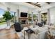Cozy living room featuring a brick fireplace, wood beams, and plush seating at 8229 N Ridgeview Dr, Paradise Valley, AZ 85253