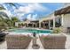 Stunning backyard featuring a sparkling pool, spa, plush lounge seating, and a beautifully designed patio at 8229 N Ridgeview Dr, Paradise Valley, AZ 85253