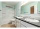Bathroom featuring double sinks, mirror, medicine cabinet and combination tub and shower at 8238 E Jackrabbit Rd, Scottsdale, AZ 85250