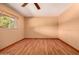Bedroom with natural lighting, wood floors, and a ceiling fan at 8238 E Jackrabbit Rd, Scottsdale, AZ 85250