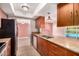 Kitchen with granite countertops and stainless steel appliances overlooks the pool at 8238 E Jackrabbit Rd, Scottsdale, AZ 85250