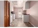 Laundry room with washer, dryer, storage and access to backyard at 8238 E Jackrabbit Rd, Scottsdale, AZ 85250