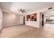 Spacious living area with tile floors, neutral walls, and an open layout connecting to the kitchen at 8238 E Jackrabbit Rd, Scottsdale, AZ 85250