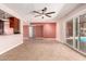 Light filled living room with tile floors and access to the outdoor pool area at 8238 E Jackrabbit Rd, Scottsdale, AZ 85250