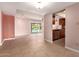 Spacious living room featuring tile floors, backyard views, and an open layout connecting to the kitchen at 8238 E Jackrabbit Rd, Scottsdale, AZ 85250