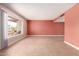 Bright living room with tile floors, neutral paint, and a large window overlooking the front yard at 8238 E Jackrabbit Rd, Scottsdale, AZ 85250