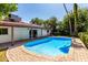 Backyard pool has brick pavers and mature landscaping for a private outdoor oasis at 8238 E Jackrabbit Rd, Scottsdale, AZ 85250