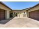 Paver courtyard featuring stone accents, a porte-cochere, and direct access to garage at 8240 E Wingspan Way, Scottsdale, AZ 85255