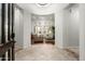 Elegant foyer with decorative tile flooring and open view to the living room with expansive windows at 8240 E Wingspan Way, Scottsdale, AZ 85255