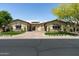 Charming front exterior featuring low-maintenance landscaping and a private courtyard at 8240 E Wingspan Way, Scottsdale, AZ 85255