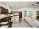 Open-concept living space with kitchen island, stainless steel appliances, and a comfortable seating area at 8240 E Wingspan Way, Scottsdale, AZ 85255