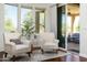 Relaxing sitting room with comfortable chairs and outdoor views through sliding glass doors at 8240 E Wingspan Way, Scottsdale, AZ 85255