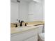 Neutral bathroom with white cabinetry, dark hardware, and light colored countertops at 8414 N Central Ave # B, Phoenix, AZ 85020