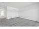Bedroom with neutral carpet and access to the bathroom with white cabinetry at 8414 N Central Ave # B, Phoenix, AZ 85020