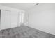 Bright carpeted bedroom with closet and exterior door at 8414 N Central Ave # B, Phoenix, AZ 85020