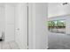Hallway with storage cabinets leading to a room with sliding doors and exterior balcony at 8414 N Central Ave # B, Phoenix, AZ 85020