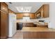 Functional kitchen with ample cabinet space, updated appliances, and breakfast bar at 8414 N Central Ave # B, Phoenix, AZ 85020