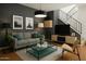 Contemporary living room with gray walls, sleek furniture, and a stylish entertainment center at 8414 N Central Ave # B, Phoenix, AZ 85020