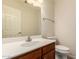 This half bathroom features a white sink and cabinet and light fixtures above the mirror at 8627 W Morrow Dr, Peoria, AZ 85382