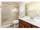 Bathroom with wood-style vanity, single sink, and enclosed shower, provides a functional and clean space at 8627 W Morrow Dr, Peoria, AZ 85382