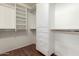 Well-organized walk-in closet featuring shelving, drawers, and hanging rods for ample storage space at 8627 W Morrow Dr, Peoria, AZ 85382