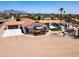 Aerial view of property showcasing outdoor living spaces and mountain views at 920 N 104Th St, Mesa, AZ 85207