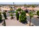 An aerial perspective showing the home, manicured lawn, desert landscaping, and ample parking at 920 N 104Th St, Mesa, AZ 85207
