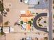 Bird's eye view of the home with a circular driveway and desert landscaping at 920 N 104Th St, Mesa, AZ 85207