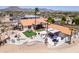 Aerial view of desert home with metal roof, patio, outdoor kitchen and artificial turf yard at 920 N 104Th St, Mesa, AZ 85207